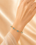 Gold Tone Tulip Crystal Bracelet with Floral Vine Design
