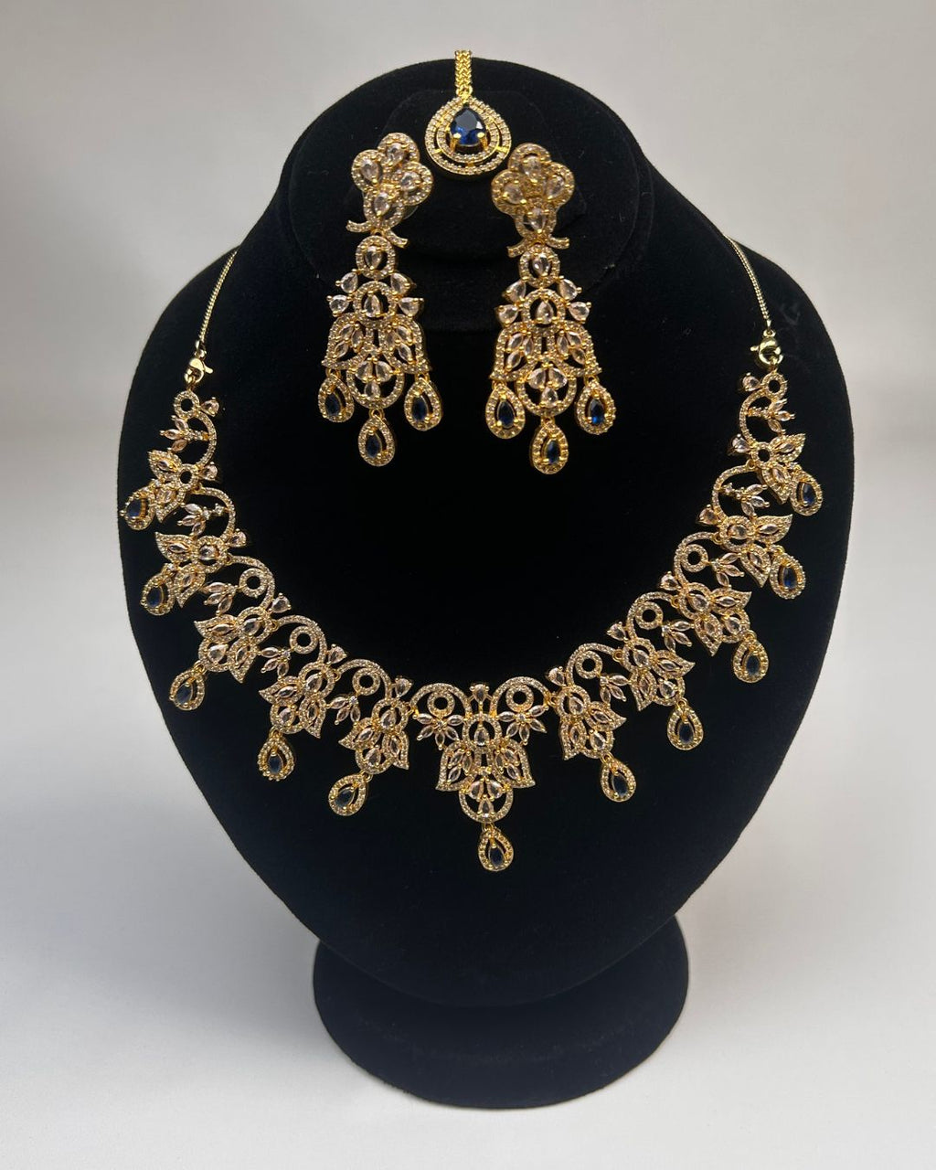 Gold Zircon Party Wear Jewelry Set with Earrings & Tikka