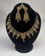 Gold Zircon Party Wear Jewelry Set with Earrings & Tikka