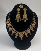 Gold Zircon Party Wear Jewelry Set with Earrings & Tikka