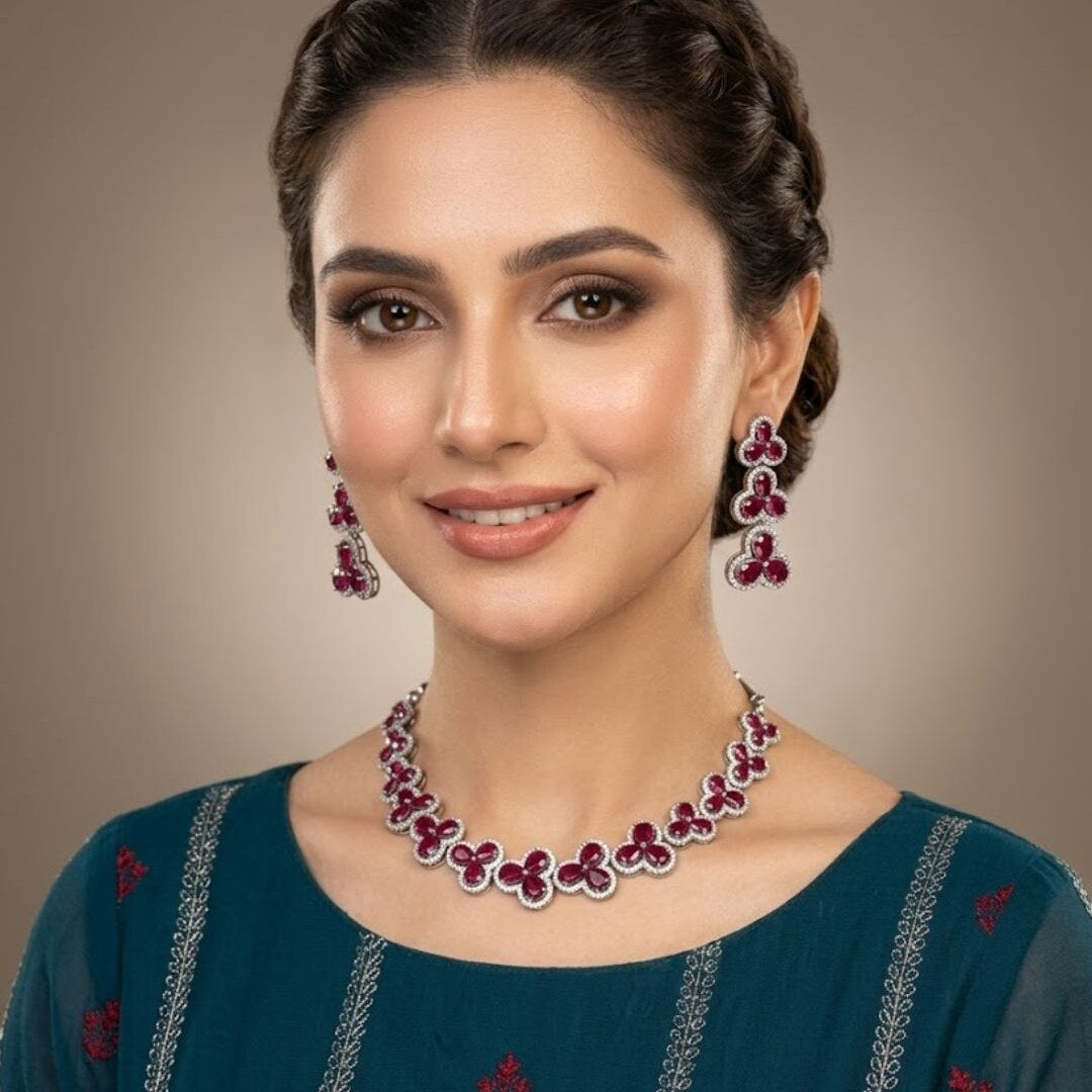 Woman wearing a silver and magenta zircon necklace and earrings set from Zurein
