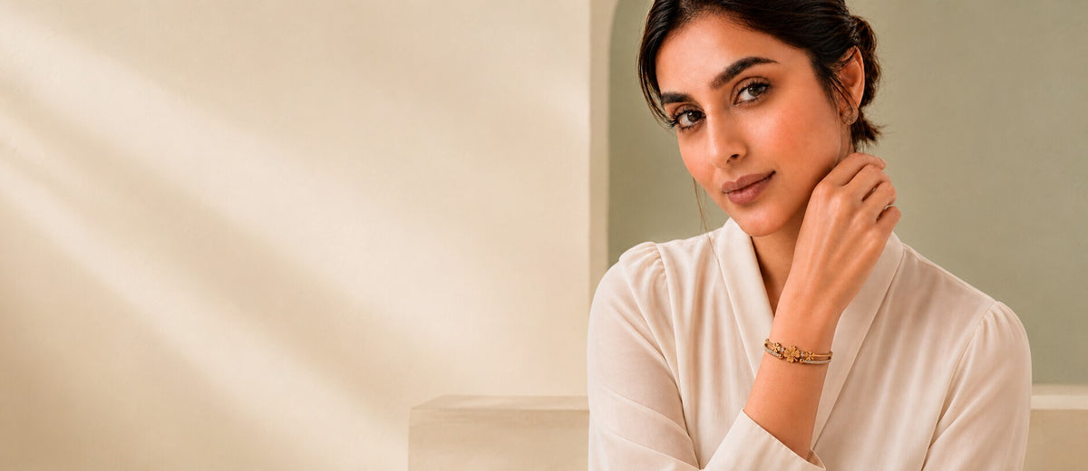 South Asian woman wearing a gold floral crystal cuff bracelet from Zurein
